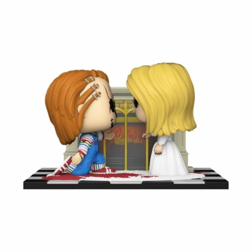 Chucky and Tiffany figurines kissing on a checkered platform.