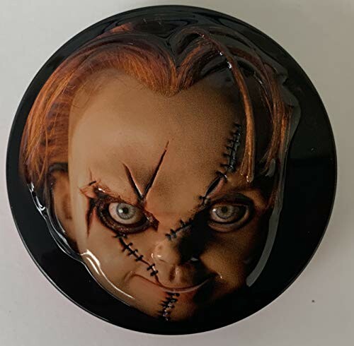 Close-up of a Chucky doll face with stitches