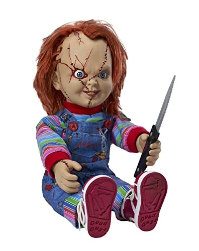 Chucky doll with red hair and knife.