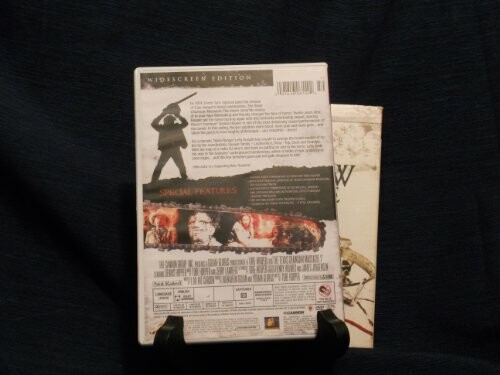 Back cover of a DVD case with special features listed.