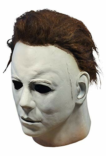 Halloween mask with white face and dark hair