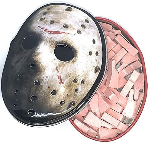 Hockey mask-shaped tin with pink cookies inside.