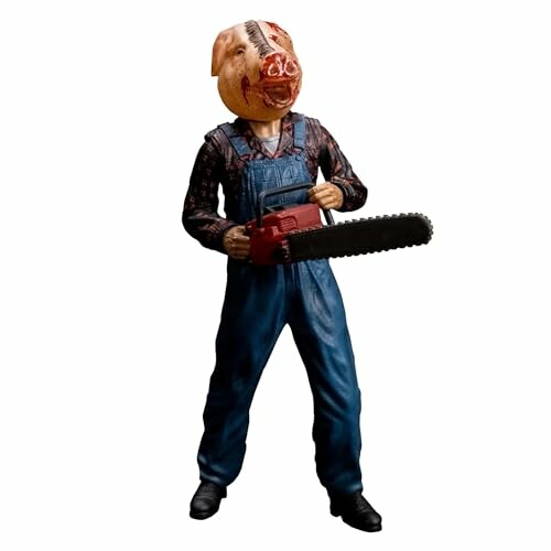 Figure of a person with a pig mask holding a chainsaw