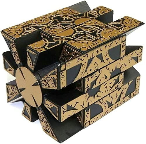 Intricate black and gold puzzle box with geometric patterns