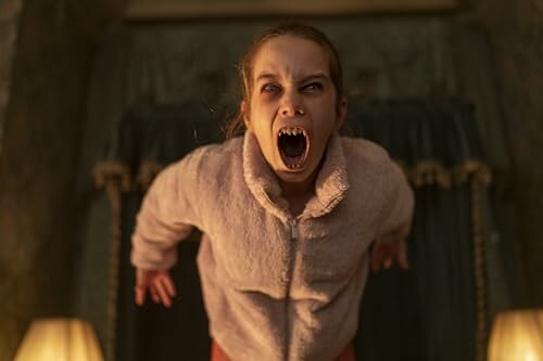 A girl with a frightening expression and mouth wide open, resembling a scream.